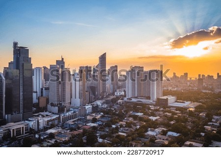 skyline of makati in metro manila, philippines at sunset