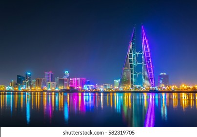 Skyline of Manama dominated by the World trade Center building during night, Bahrain.