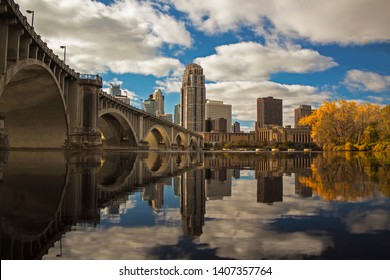 skyline of Minneapolis reflected in Mississippi River, landscape orientation