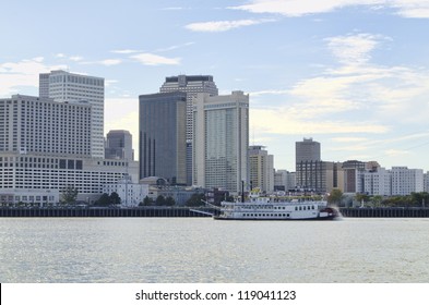 Skyline Of New Orleans,  Louisiana. Paddlewheel Steamboat In Foreground.