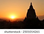 The skyline of the old town of Bhaktapur and the silhouette, contour of the Shilu, Silu Mahadeva, Mahadev Temple at sunset, Bhaktapur, Nepal 2022