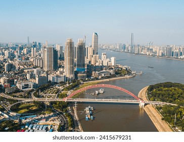 A skyline on both sides of the Yangtze River in Wuhan crossed by bridges