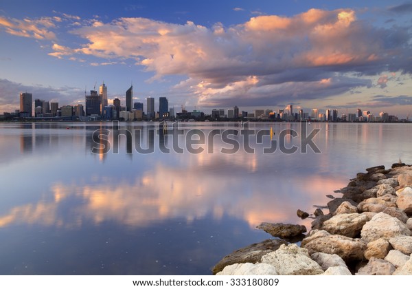 The skyline of Perth, Western\
Australia at sunset. Photographed from across the Swan\
River.