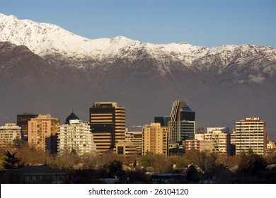 Skyline of Providencia district in Santiago de Chile with snowed Andes mountain range in the background.  This is a wealthy residential and commercial district in the city.