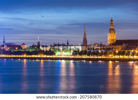 Skyline of Riga seen across the river Daugava after the sunset. The tallest building on the picture is the Riga Dome cathedral, smaller one to the left is St. Saviour's Church 
