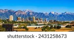 Skyline of Salt Lake City downtown in Utah with Wasatch Range Mountains in the background.