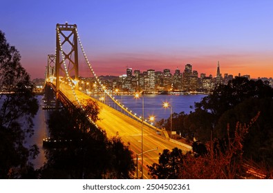 Skyline of San Francisco at night, Oakland Bay Bridge, Yerba Buena Island, California, USA - Powered by Shutterstock