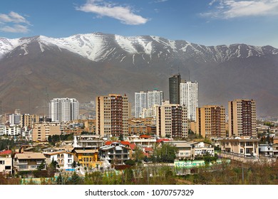 Skyline Of Tehran Against Snow Capped Mountains, Iran.