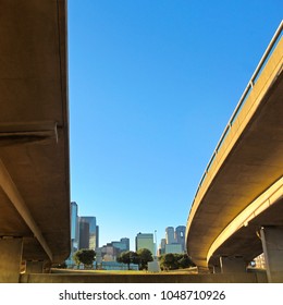 Skyline From Underside Of A Freeway On A Sunny Day In Dallas, Texas, USA.
Cityscape Of Modern Buildings And Skyscrapers In City Center District Against A Blue Sky.