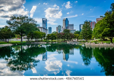 The skyline of Uptown Charlotte, and lake at Marshall Park, in Uptown Charlotte, North Carolina.
