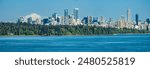 Skyline of Vancouver with Mount Rainier in the background and Stanley Park in the foreground, British Columbia, Canada