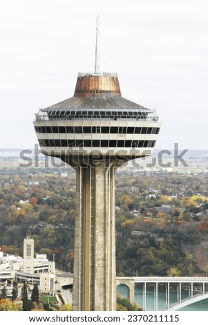 Skylon Tower observation deck. Niagara Falls, Ontario, Canada. Fall panorama. Autumn. Foliage. International bridge to U.S.A. River. Landmark. Travel and tourism. Honeymoon destination.