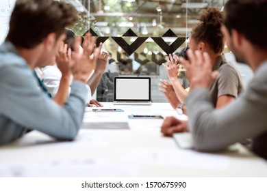 Skype Call. Group Of Business People Having Video Conference While Sitting In Meeting Room. Business Team Looking At The Screen Of Laptop