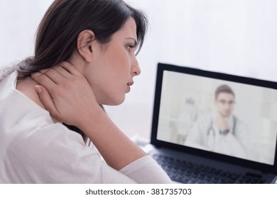 Skype Doctor And Woman With Neck Pain In Front Of Laptop