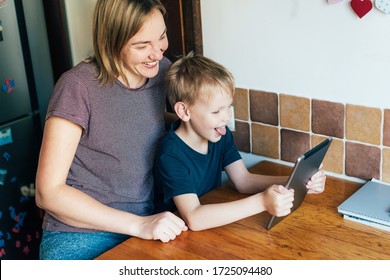 Skype And Zoom Family Chat. Mom And Son Are Talking On An Online Conference Call. Family Joy. Spending Time Together While Staying At Home On Self Isolation. Quarantine