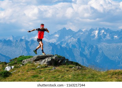 Skyrunning Athlete In Training On Mountain Ridges.