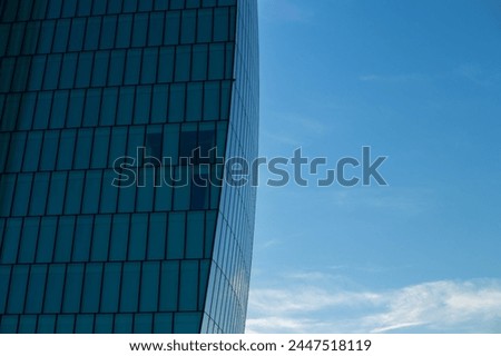 Skyscraper against the blue sky. Place for text. Glass buildings in Milan, Italy. CityLife Shopping District complex - the new commercial and residential area. Finance, economics, future concepts. 