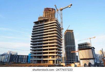 Skyscraper Construction. Tower Crane on formworks on construction site. Construction crane on Housing. Construction of Multi Storey Residential Building. Skyscraper built. Tower Cranes on building. - Powered by Shutterstock