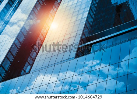 Skyscraper or modern building in the city with cloud and sunlight