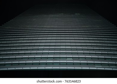 Skyscraper at night. Abstract background. Bottom view