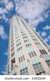 skyscraper on cloudy sky