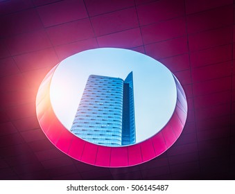 skyscraper seen through the abstract ceiling of modern building.