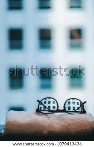 A skyscraper through the glasses