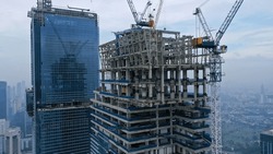 Skyscraper Under Construction, With Crane On Top, For Urban And Industrial Themes