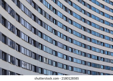 skyscraper windows reflecting bright cloudy sky