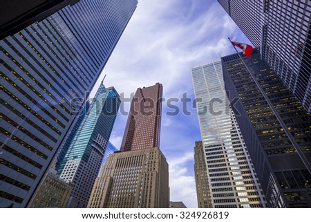 Skyscrapers against a cloudy blue sky in financial district of Toronto  Canada.