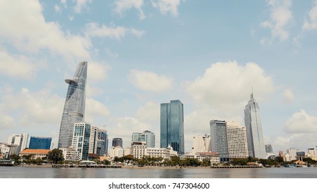 Skyscrapers business center in Ho Chi Minh City on Vietnam on against the background of drooping branches of trees.