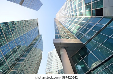 Skyscrapers in a business district on a sunny morning - Shutterstock ID 597420842