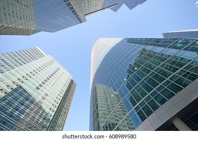 Skyscrapers in a business district on a sunny morning - Shutterstock ID 608989580