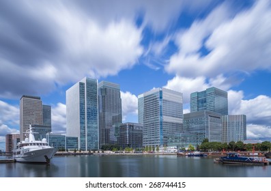 Skyscrapers Of Canary Wharf With Moving Clouds In Color, London, UK