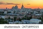 Skyscrapers day to night transition timelapse from rooftop, Kremlin towers and churches, stalin houses at evening aerial panorama in Moscow, Russia. Sunset orange sky