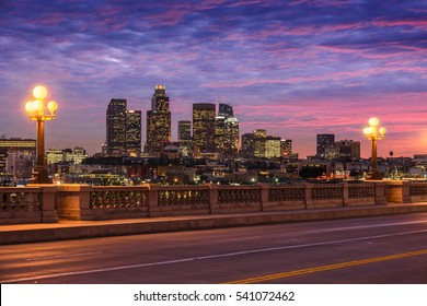 Skyscrapers In Downtown Los Angeles California At Sunset. View From Bridge