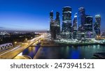 Skyscrapers International Business Center City at night with Moscow river timelapse from top, Moscow, Russia. Aerial view from above after sunset with illuminated towers