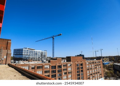 skyscrapers and office buildings in the cityscape with red brick buildings and lush green and autumn colored trees with blue sky at he Roof top at Ponce City Market in Atlanta Georgia USA	 - Powered by Shutterstock