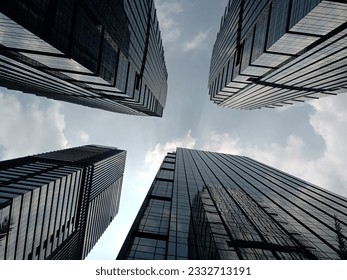 skyscrapers seen from below against a blue sky