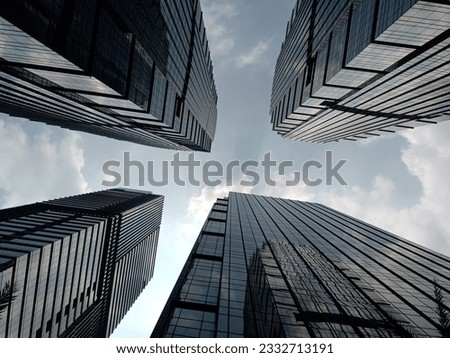 skyscrapers seen from below against a blue sky