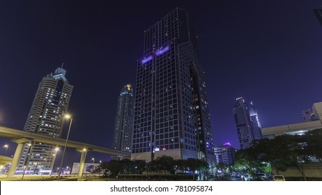 Skyscrapers at the Sheikh Zayed Road at night with traffic near hotel and lighhs torn on in Dubai timelapse hyperlapse 4K - Shutterstock ID 781095874