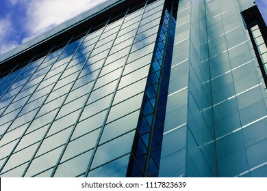 Skyscrapper Building On A Blue Sky Background.