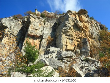 Skytop Tower at the top of limestone cliffs towering over Mohonk Lake in the Shawangunk Mountains of New York in the Mohonk Preserve