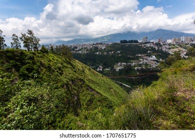 slackline between two trees in a large gorge near the Guapulo neighborhood