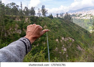 slackline between two trees in a large gorge near the Guapulo neighborhood