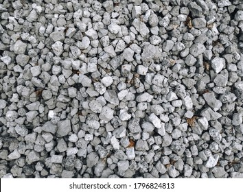 Slag in the form of gray stones, top view. Waste rock during iron ore mining.