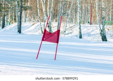 Slalom Flag Standing In The Snow On The Ski Slopes.