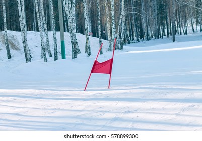 Slalom Flag Standing In The Snow On The Ski Slopes.