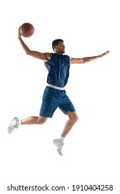 Slam Dunk. Young Arabian Muscular Basketball Player In Action, Motion Isolated On White Background. Concept Of Sport, Movement, Energy And Dynamic, Healthy Lifestyle. Training, Practicing.