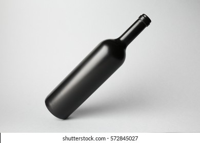 Slanted bottle on gray background